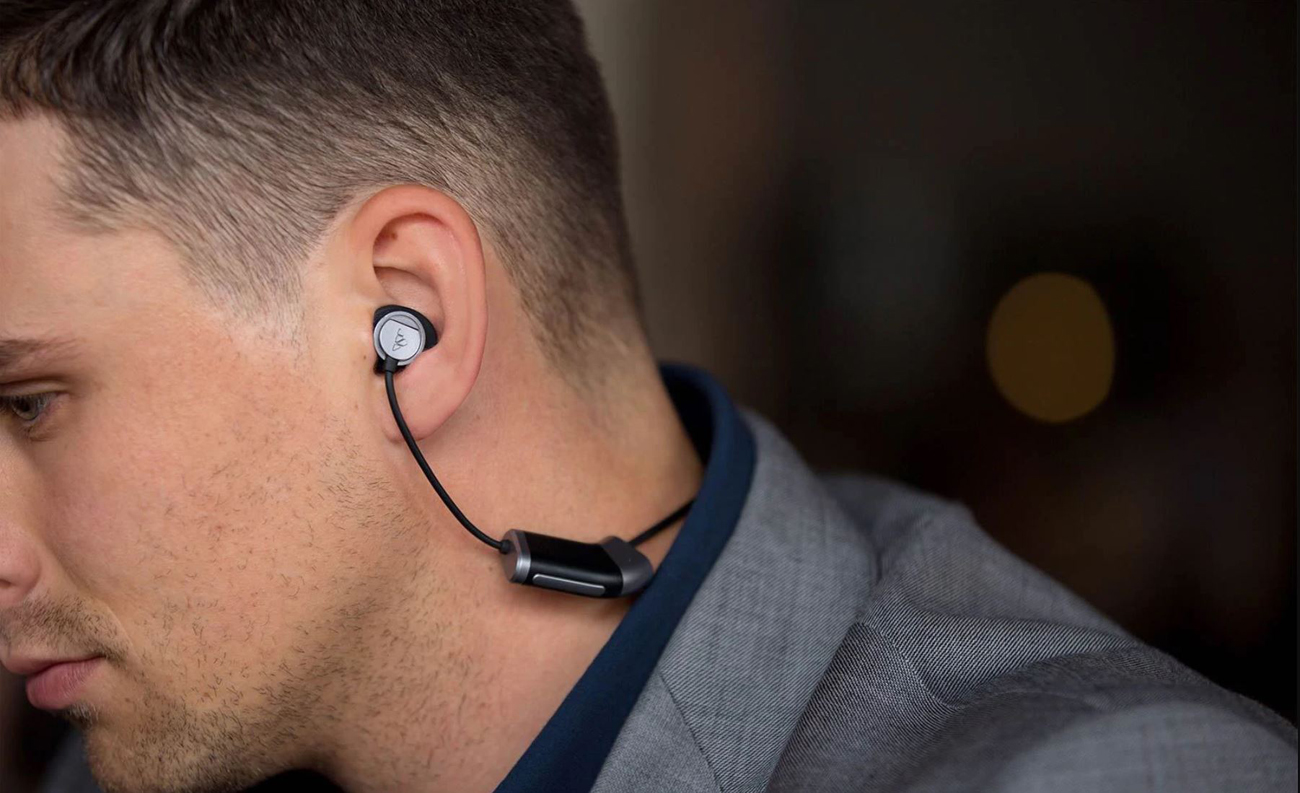A man with Zipbuds 26 Sport Headphones in is shown in close-up.